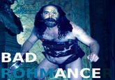 Fat hairy man in a speedo with guns and Guitar Hero controllers